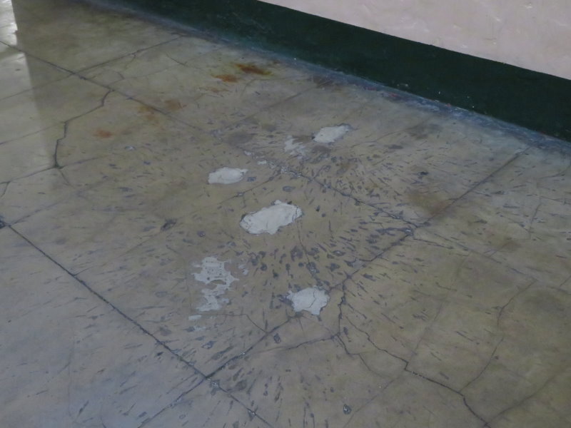 Marks on the floor from a grenade dropped in on armed escaped prisoners